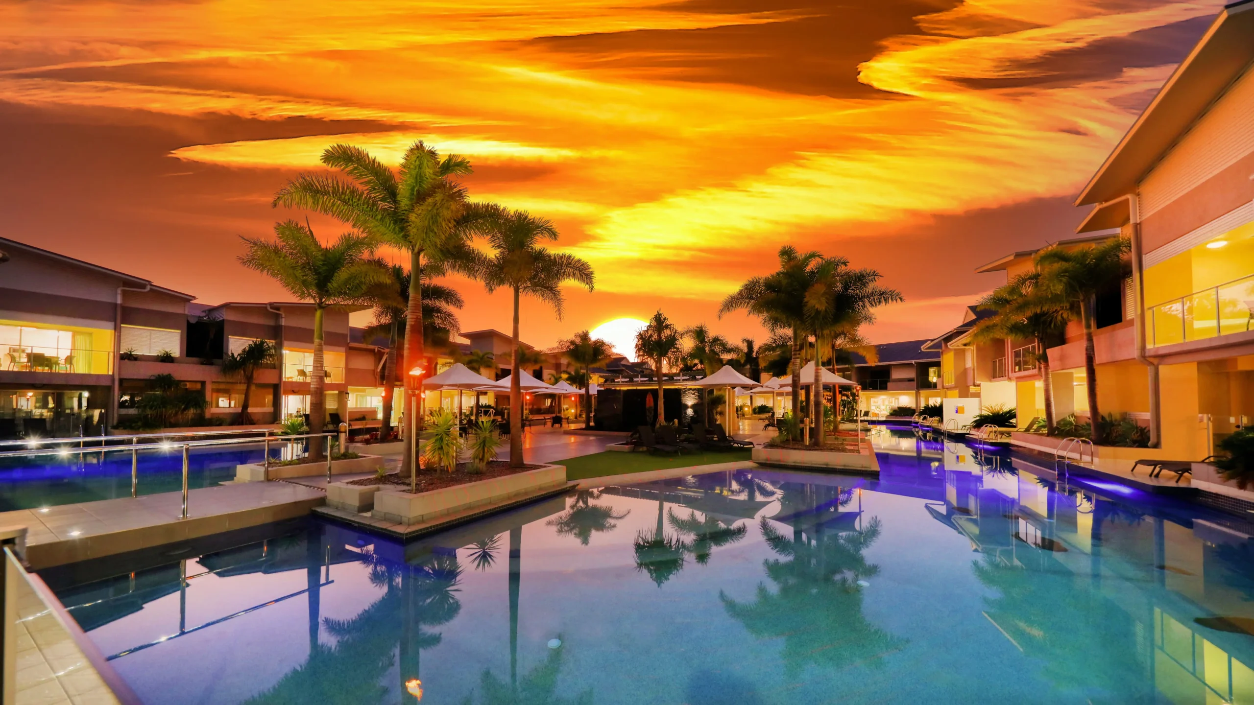 Luxurious poolside accommodation at sunset, ideal for 1770 conference attendees in Agnes Water