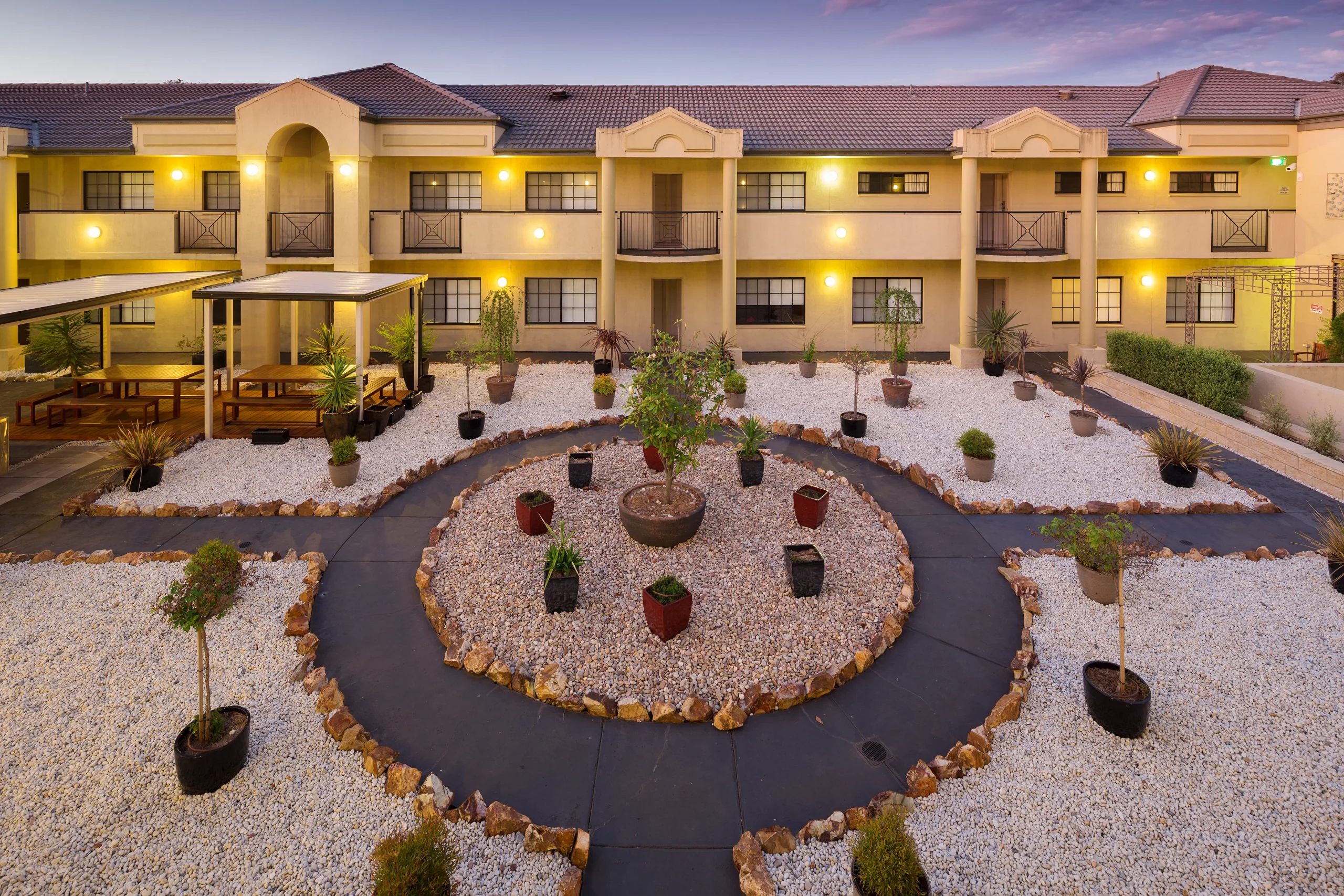 Landscaped courtyard at Canberra Parklands Central Apartment Hotel, ideal for Canberra conference guests to relax and network