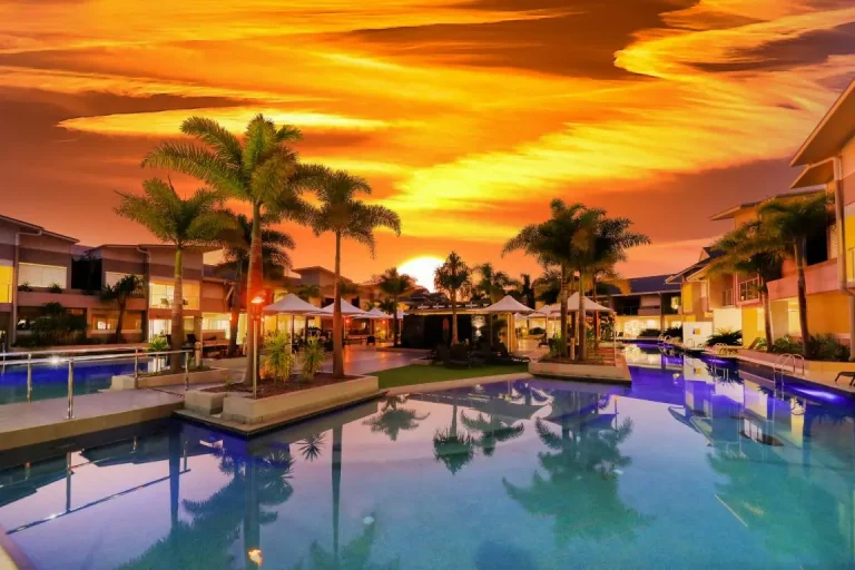 1770 Lagoons Central Apartment Resort conference venue with tropical poolside setting at sunset