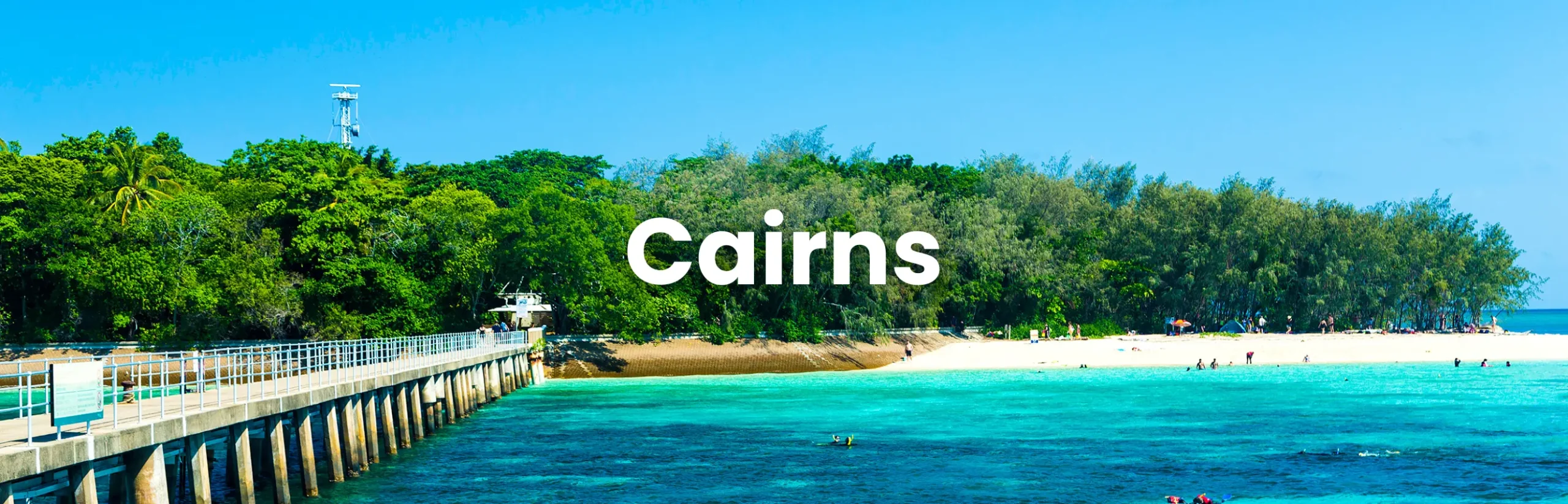 Tropical beach and turquoise water in Cairns, Queensland, ideal for hosting the Cairns Conference.